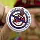 A man holds up an anti-mascot button to protest using Native Americans as mascots for sports teams at a 2003 event in Ohio. On May 16, 2019, the governor of Maine signed into law a bill banning the use of Native American imagery and symbols as mascots at all public schools and universities.
